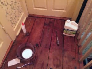 Use mineral spirits to remove wax from the wood floor